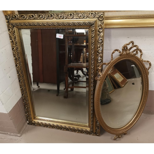 629 - A mirror in rectangular gilt frame; an oval mirror in gilt frame