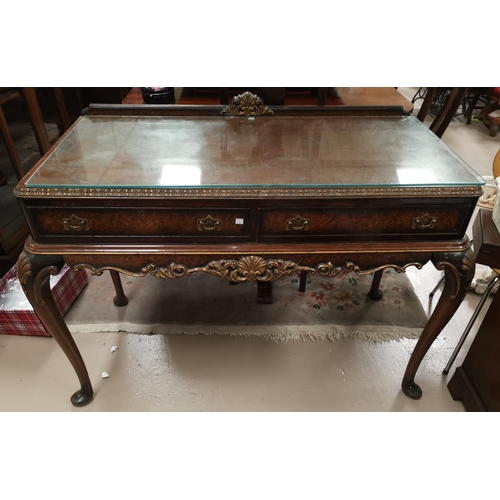 654 - A GI style parcel gilt and  walnut side serving table with 2 friezed drawers and carved cabriole leg... 