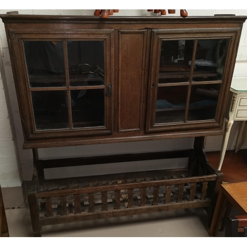677 - a 19th century continental wall cabinet with 2 glazed doors with associated lattice trough base