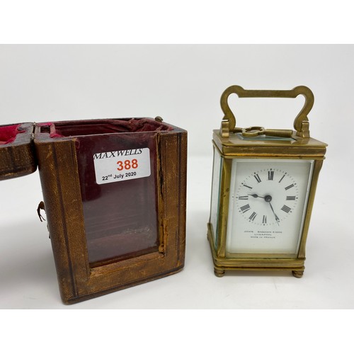 388 - A 19th century brass carriage clock with timepiece movement in original red leather outer case; 3 sm... 