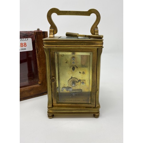 388 - A 19th century brass carriage clock with timepiece movement in original red leather outer case; 3 sm... 