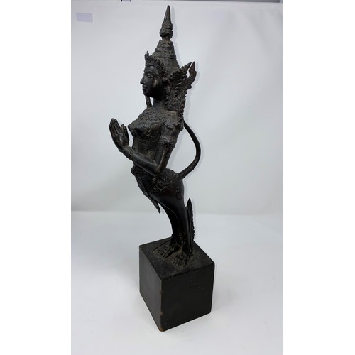 367 - A Thai bronze sculpture of a deity in praying position on wooden plinth  height 52cm