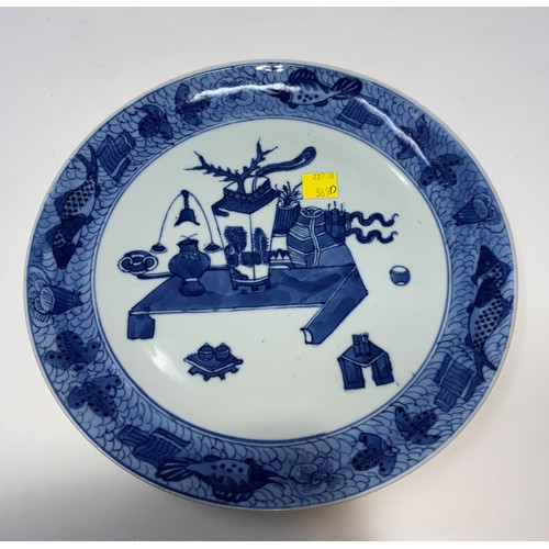 369D - A Chinese blue and white plate decorated with antique vases etc and another blue and white plate bot... 