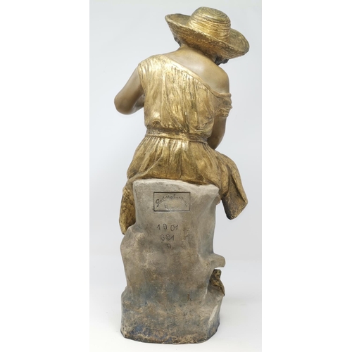 292 - A Goldscheider figure:  girl in sunhat holding a fish, impressed 'Goldscheider 191 G32, 9, signed 'C... 