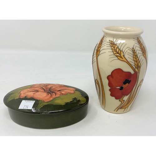 214 - A Moorcroft baluster vase decorated with red poppy and  barley, impressed and with original label, h... 