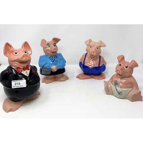 218 - A NatWest money box Wade pig family:  father, mother, son and baby