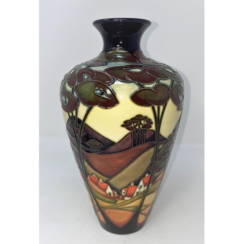 245 - A modern Moorcroft vase of tapering form, decorated with a landscape, cottages and trees by Sian Lee... 