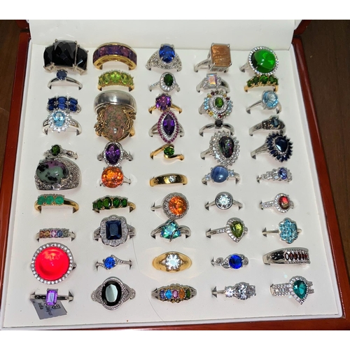 320 - Fifty white metal/plated decorative dress rings set coloured stones, mostly stamped '925'
