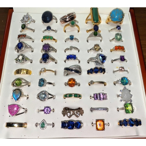 321 - Fifty white metal/plated decorative dress rings set coloured stones, mostly stamped '925'
