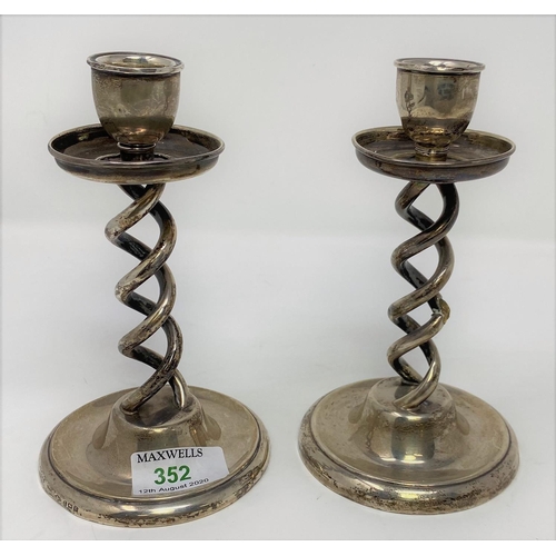 352 - A pair of silver open barley twist candlesticks on circular weighted bases, Birmingham 1924, height ... 