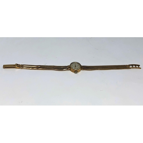 380 - A ladies 9 carat wristwatch on 9 carat mesh strap, 22.8 gm