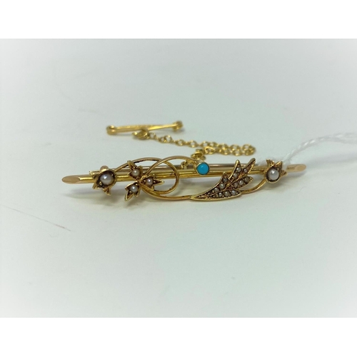 389 - A gold brooch set with seed pearls and small turquoise, marks unclear but tests as 18 carat, 3.2gm