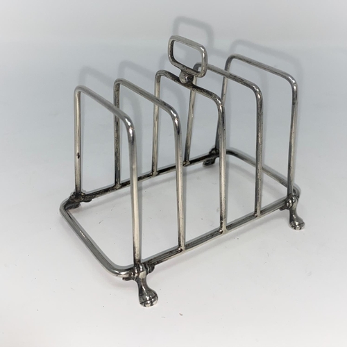 430 - A rectangular four division wire work hall marked silver toast rack  Birmingham 1922 2.5oz (76gms)