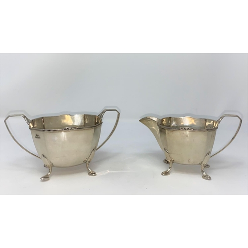 435 - An Art Deco hall marked silver coffee set of canted rectangular tapering design with beaded rim and ... 