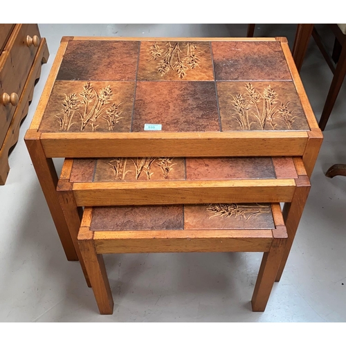 535 - A nest of teak tables with tile tops; a tall stool