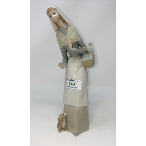 243 - A Lladro figure of a nun; another small figure