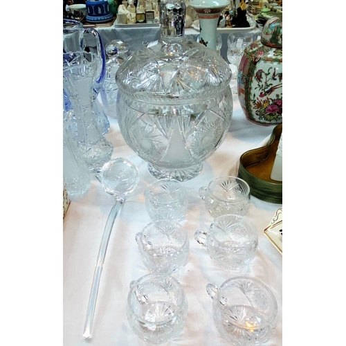 262 - A large cut glass covered punch bowl and ladle, height 33 cm and a set of 6 cups