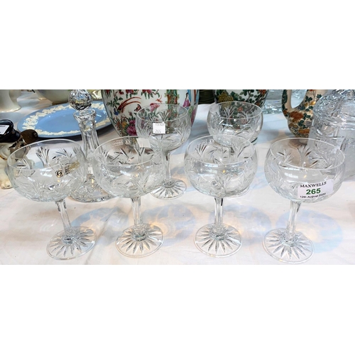 265 - A set of 6 cut crystal coupe glasses; a similar decanter