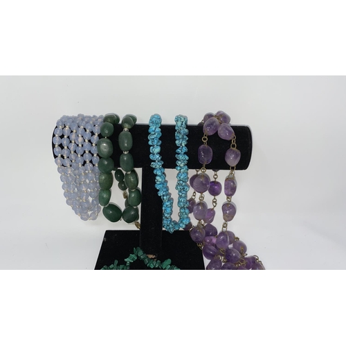 398 - A selection of necklaces including jade colour, Blue John colour etc