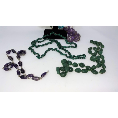 398 - A selection of necklaces including jade colour, Blue John colour etc