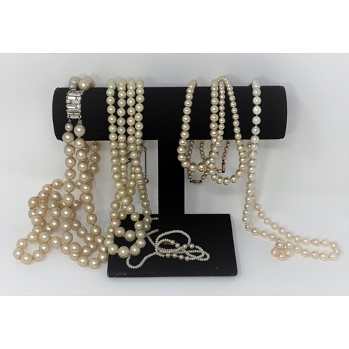 399 - A cultured pearl necklace and other faux pearl necklaces