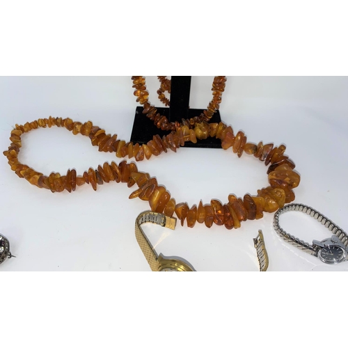 421 - Reconstituted amber beads, Seiko automatic lady's watch etc