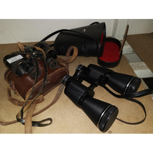 117 - A WWII pair of binoculars by G Fournier of Paris, cased; a modern pair of binoculars