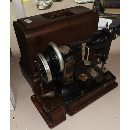 118 - A vintage sewing machine by Wheeler & Wilson, in original case