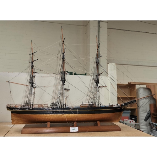 148 - A wooden model of a rigged 3 mast schooner