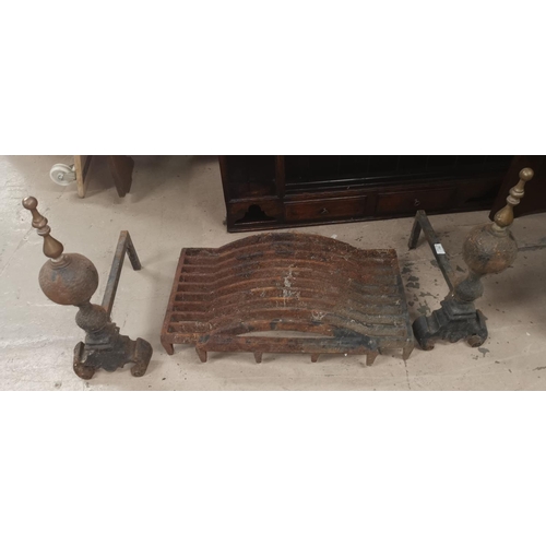 167 - A pair of cast iron and brass fire dogs and dog grate