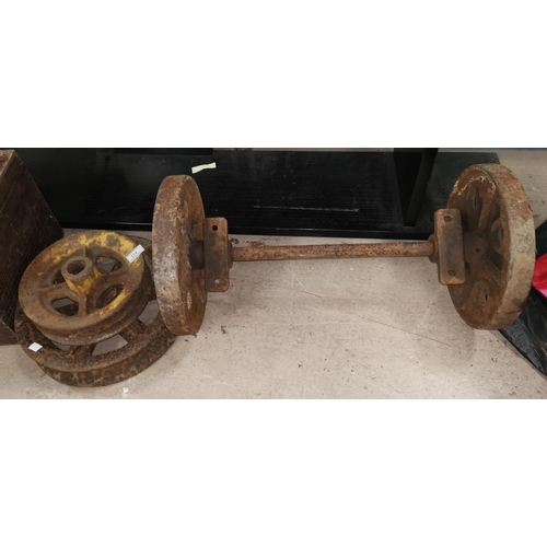 174 - 2 cast iron wheels and similar bogey