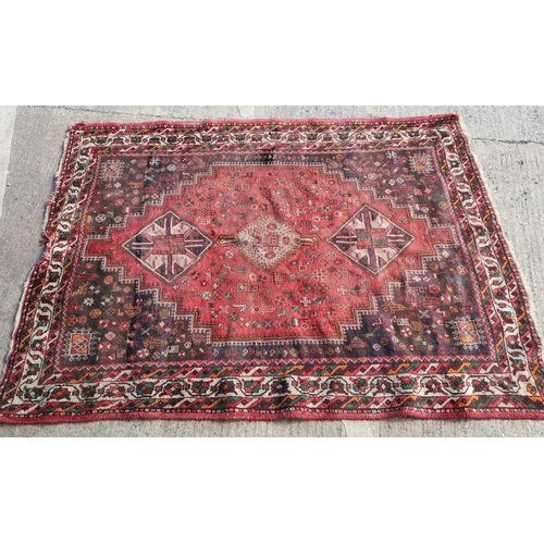 619 - A hand woven Afghan carpet rust ground with geometric design 220cm x 136cm