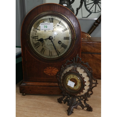 70 - An Edwardian chiming mantel clock in Sheraton style arch top case; a French small bronzed mantel clo... 