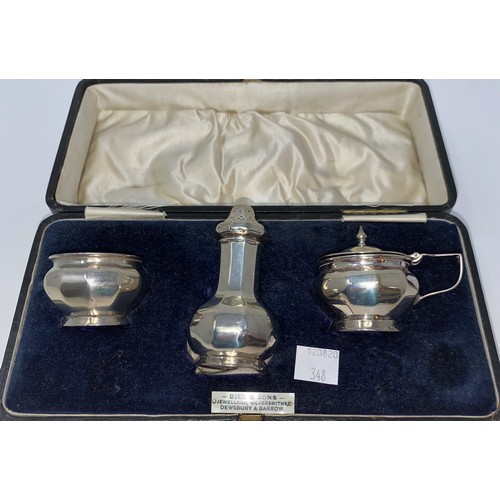 348 - A 3 piece silver cruet set with ribbed decoration, boxed, Birmingham 1923, 2.5 oz