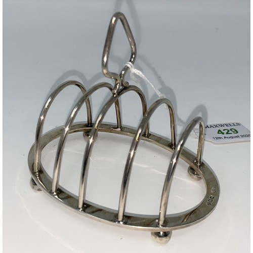 429 - An oval four division wire work toast rack Sheffield 1966 2.9oz (93gms)