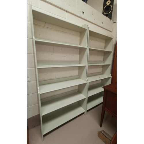492a - A pair of full height book cases in cream