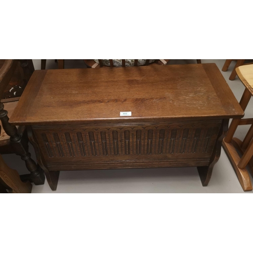 502 - A reproduction carved oak blanket box