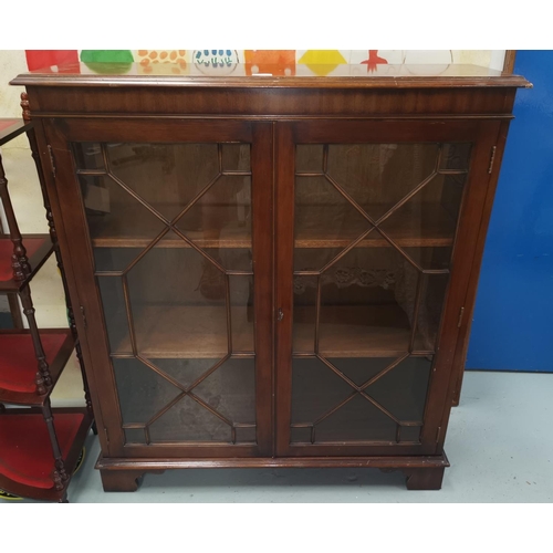 516 - A mahogany reproduction display cabinet with astragal glazed doors