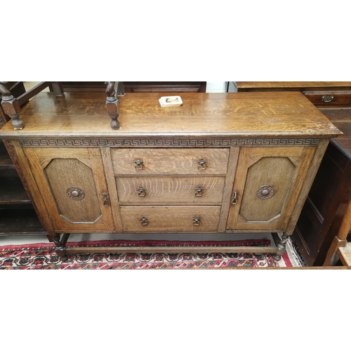 518 - A 1930's oak sideboard of 2 cupboards and 3 drawers on barley twist legs