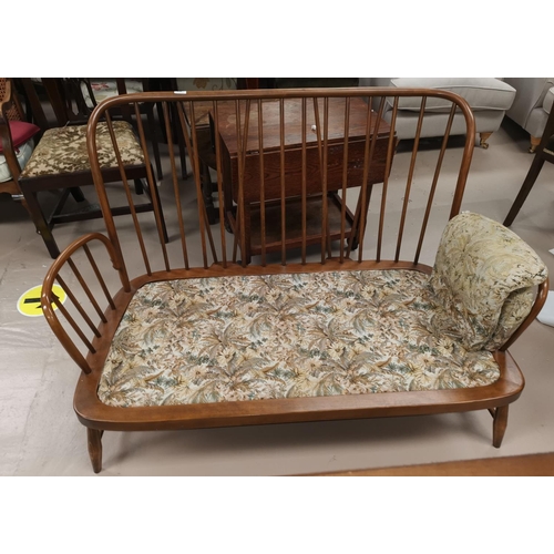 613 - An Ercol style 2 seater settee with floral upholstery, frame only