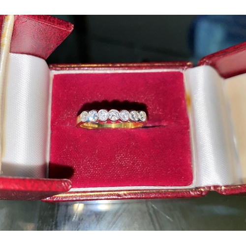 367 - An 18 carat gold half eternity ring set 7 diamonds, 2.3 gm