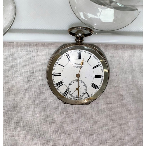 373 - An oval faced key wound gent's pocket watch in engine turned silver case