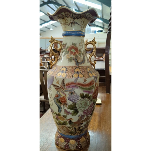 33 - A large Japanese  vase with flared rim decorated with birds, on wooden stand, height 60 cm