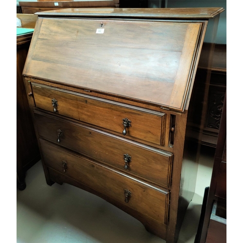 592 - A 1920's walnut fall front bureau of 3 drawers