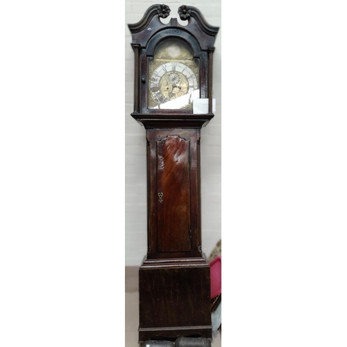 592A - An 18th century Scottish mahogany longcase clock, the hood with swan neck pediment, carved flower he... 