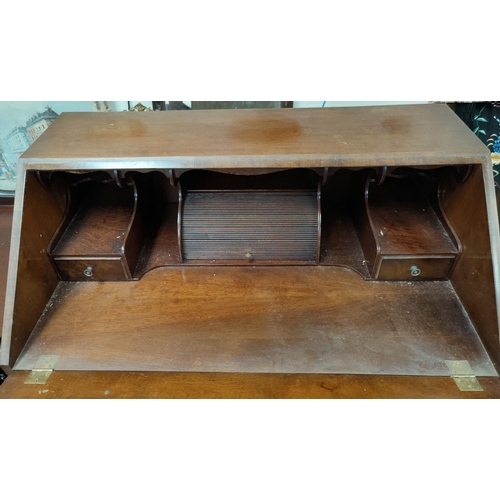 605 - A reproduction fall front bureau in crossbanded burr walnut, with fitted interior and 4 drawers