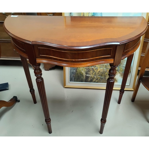 614 - A mahogany reproduction side table with single drawer; a reproduction wine table