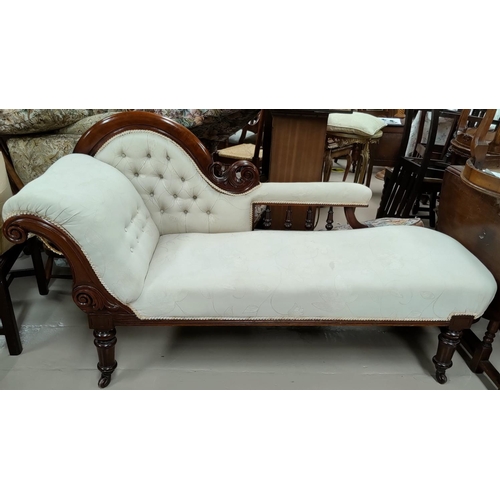 626 - A Victorian mahogany single scroll end acanthus carved chaise longue in deeply buttoned cream brocad... 