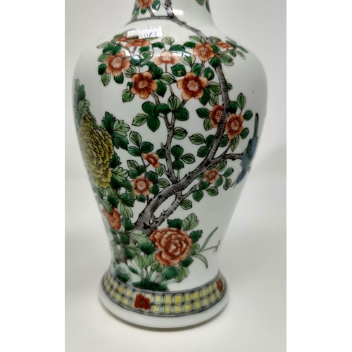 260a - A Chinese inverted baluster vase with slender neck, decorated in Imari palette, 6 character signatur... 