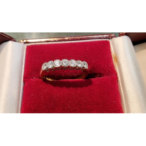 367 - An 18 carat gold half eternity ring set 7 diamonds, 2.3 gm